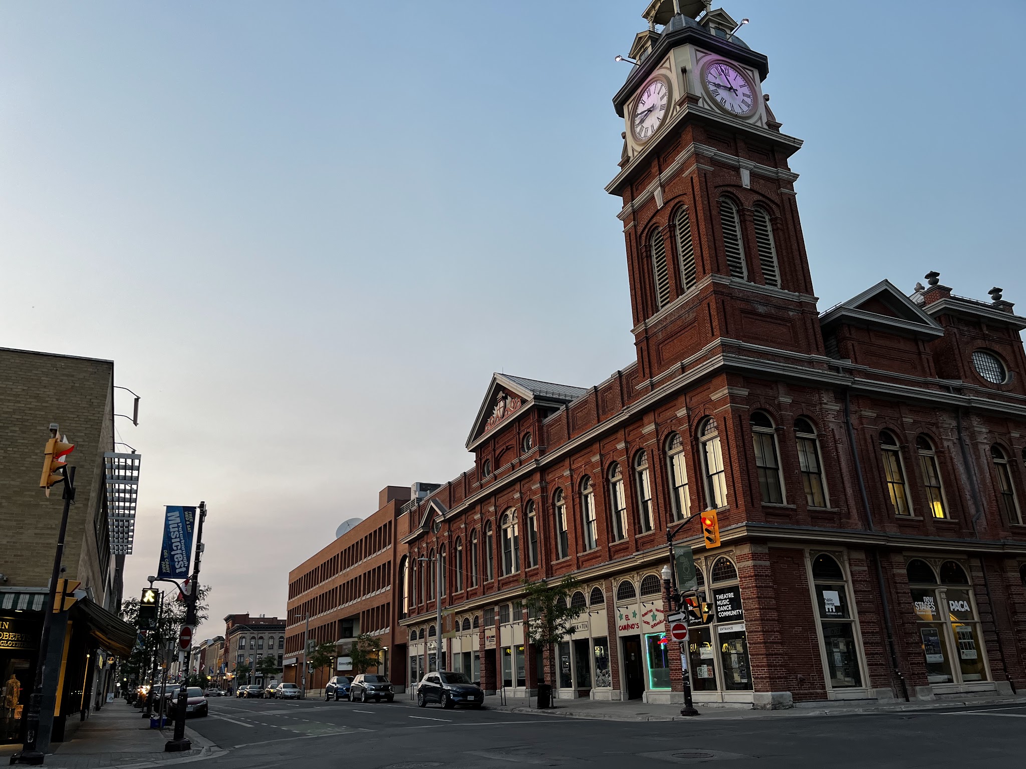 Peterborough City Hall clock tower at dusk beside Peterborough Square